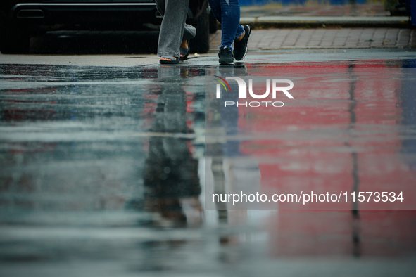 People with umbrellas are seen during a bout of rain in Warsaw, Poland on 14 September, 2024. Warnings for heavy rainfall and severe floodin...