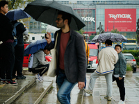 People with umbrellas are seen during a bout of rain in Warsaw, Poland on 14 September, 2024. Warnings for heavy rainfall and severe floodin...