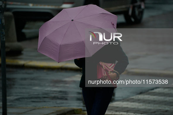 People with umbrellas are seen during a bout of rain in Warsaw, Poland on 14 September, 2024. Warnings for heavy rainfall and severe floodin...