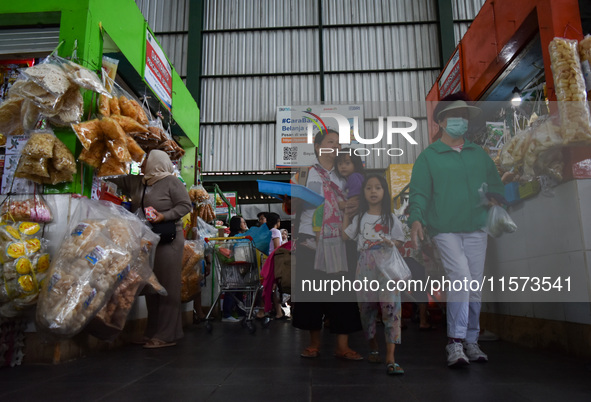 Activities of visitors and traders at Oro Oro Dowo traditional market in Malang, East Java, Indonesia, on September 14, 2024. This tradition...