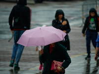 People with umbrellas are seen during a bout of rain in Warsaw, Poland on 14 September, 2024. Warnings for heavy rainfall and severe floodin...