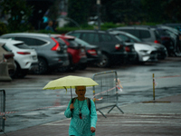 People with umbrellas are seen during a bout of rain in Warsaw, Poland on 14 September, 2024. Warnings for heavy rainfall and severe floodin...