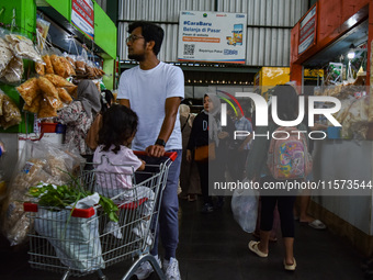 Activities of visitors and traders at Oro Oro Dowo traditional market in Malang, East Java, Indonesia, on September 14, 2024. This tradition...