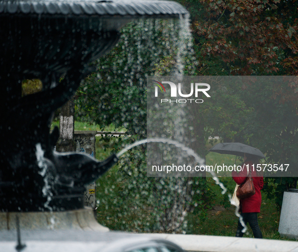 People with umbrellas are seen during a bout of rain in Warsaw, Poland on 14 September, 2024. Warnings for heavy rainfall and severe floodin...