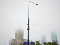 Fog is seen partly covering the city skyline in Warsaw, Poland on 14 September, 2024. Warnings for heavy rainfall and severe flooding have b...