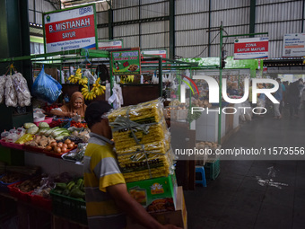 Activities of visitors and vegetable traders at Oro Oro Dowo traditional market in Malang, East Java, Indonesia, on September 14, 2024. This...