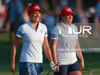 GAINESVILLE, VIRGINIA - SEPTEMBER 14: Lexi Thompson of the United States and Lauren Coughlin of the United States walk together to the 3rd g...