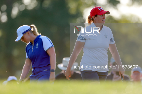 GAINESVILLE, VIRGINIA - SEPTEMBER 14: Lauren Coughlin (R, foreground) of the United States walks on the 3rd green past Maja Stark  (L, backg...