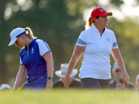 GAINESVILLE, VIRGINIA - SEPTEMBER 14: Lauren Coughlin (R, foreground) of the United States walks on the 3rd green past Maja Stark  (L, backg...