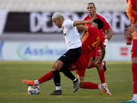 In Ta' Qali, Malta, on September 14, 2024, Kleiton do Monte Lima Basilio of Hibernians is closely challenged by Leandro Lautaro Lacunza of B...