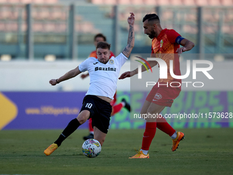 Jurgen Degabriele (L) of Hibernians competes for the ball with Kurt Zammit (R) of Birkirkara during the Malta 360 Sports Premier League socc...