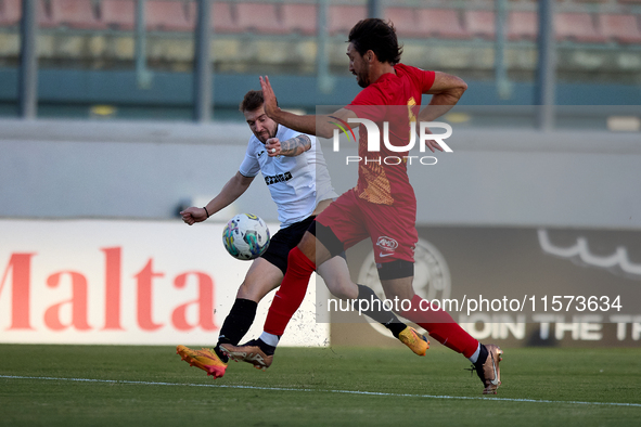 Jurgen Degabriele (L) of Hibernians is in action during the Malta 360 Sports Premier League soccer match between Hibernians and Birkirkara a...