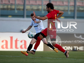 Jurgen Degabriele (L) of Hibernians is in action during the Malta 360 Sports Premier League soccer match between Hibernians and Birkirkara a...