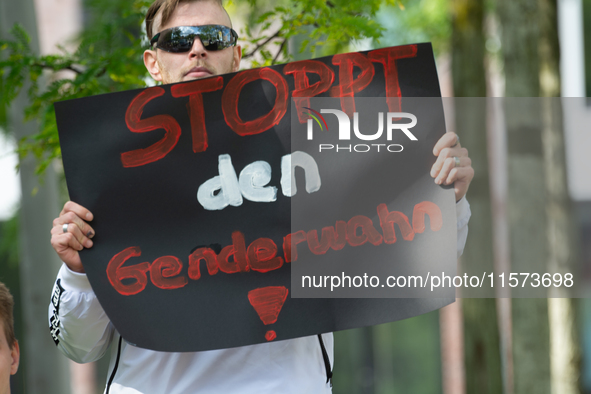 A protester holds a sign reading ''Stop Gender Choice'' as dozens of counter-protesters from several right-wing groups organize a demonstrat...