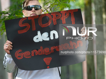 A protester holds a sign reading ''Stop Gender Choice'' as dozens of counter-protesters from several right-wing groups organize a demonstrat...