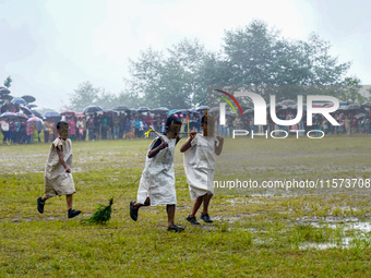 The Nepalese community wears traditional clothes and celebrates the Dhan Ropai festival in Panchthar, Nepal, on September 14, 2024. (