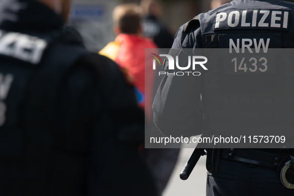 A protester with an AFD flag is seen as dozens of counter-protesters from several right-wing groups organize a demonstration against the ann...