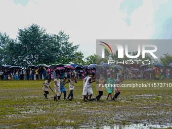 The Nepalese community wears traditional clothes and celebrates the Dhan Ropai festival in Panchthar, Nepal, on September 14, 2024. (