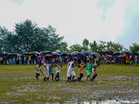 The Nepalese community wears traditional clothes and celebrates the Dhan Ropai festival in Panchthar, Nepal, on September 14, 2024. (