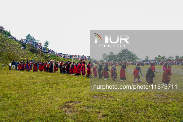 The Nepalese community wears traditional clothes and celebrates the Dhan Ropai festival in Panchthar, Nepal, on September 14, 2024. 