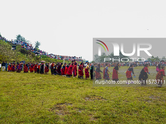 The Nepalese community wears traditional clothes and celebrates the Dhan Ropai festival in Panchthar, Nepal, on September 14, 2024. (