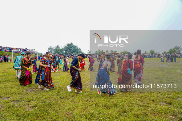 The Nepalese community wears traditional clothes and celebrates the Dhan Ropai festival in Panchthar, Nepal, on September 14, 2024. 