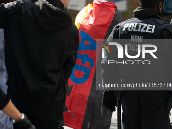 A protester with an AFD flag is seen as dozens of counter-protesters from several right-wing groups organize a demonstration against the ann...