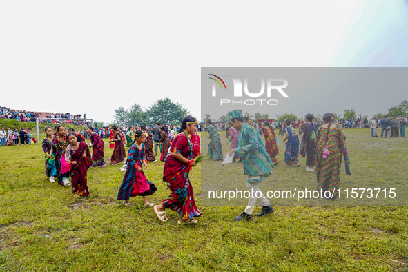 The Nepalese community wears traditional clothes and celebrates the Dhan Ropai festival in Panchthar, Nepal, on September 14, 2024. 