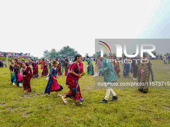 The Nepalese community wears traditional clothes and celebrates the Dhan Ropai festival in Panchthar, Nepal, on September 14, 2024. (