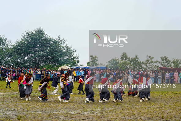 The Nepalese community wears traditional clothes and celebrates the Dhan Ropai festival in Panchthar, Nepal, on September 14, 2024. 