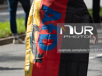 A protester with an AFD flag is seen as dozens of counter-protesters from several right-wing groups organize a demonstration against the ann...