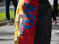 A protester with an AFD flag is seen as dozens of counter-protesters from several right-wing groups organize a demonstration against the ann...