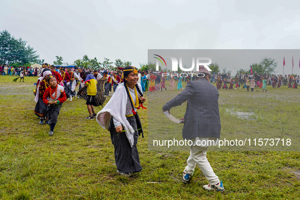 The Nepalese community wears traditional clothes and celebrates the Dhan Ropai festival in Panchthar, Nepal, on September 14, 2024. 