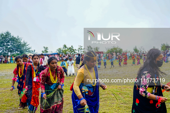 The Nepalese community wears traditional clothes and celebrates the Dhan Ropai festival in Panchthar, Nepal, on September 14, 2024. 