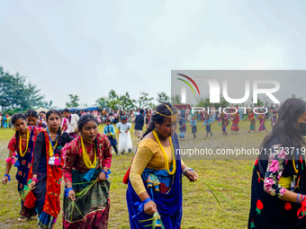 The Nepalese community wears traditional clothes and celebrates the Dhan Ropai festival in Panchthar, Nepal, on September 14, 2024. (