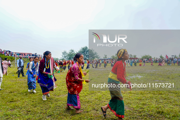 The Nepalese community wears traditional clothes and celebrates the Dhan Ropai festival in Panchthar, Nepal, on September 14, 2024. 