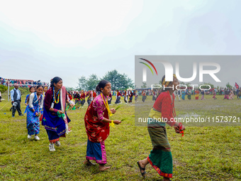 The Nepalese community wears traditional clothes and celebrates the Dhan Ropai festival in Panchthar, Nepal, on September 14, 2024. (