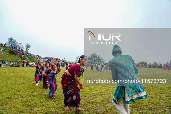 The Nepalese community wears traditional clothes and celebrates the Dhan Ropai festival in Panchthar, Nepal, on September 14, 2024. 