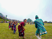 The Nepalese community wears traditional clothes and celebrates the Dhan Ropai festival in Panchthar, Nepal, on September 14, 2024. (