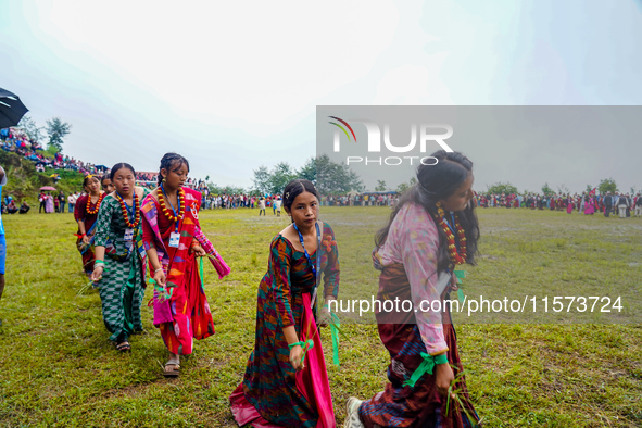 The Nepalese community wears traditional clothes and celebrates the Dhan Ropai festival in Panchthar, Nepal, on September 14, 2024. 