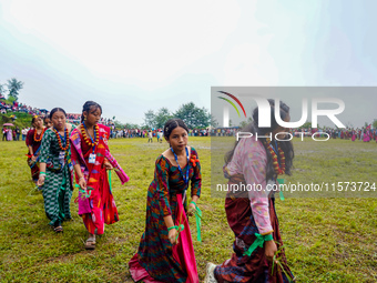 The Nepalese community wears traditional clothes and celebrates the Dhan Ropai festival in Panchthar, Nepal, on September 14, 2024. (