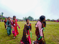 The Nepalese community wears traditional clothes and celebrates the Dhan Ropai festival in Panchthar, Nepal, on September 14, 2024. (