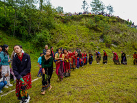 The Nepalese community wears traditional clothes and celebrates the Dhan Ropai festival in Panchthar, Nepal, on September 14, 2024. (