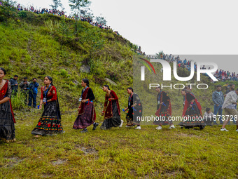 The Nepalese community wears traditional clothes and celebrates the Dhan Ropai festival in Panchthar, Nepal, on September 14, 2024. (