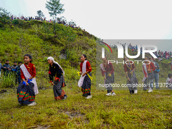 The Nepalese community wears traditional clothes and celebrates the Dhan Ropai festival in Panchthar, Nepal, on September 14, 2024. (