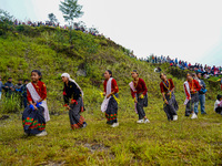 The Nepalese community wears traditional clothes and celebrates the Dhan Ropai festival in Panchthar, Nepal, on September 14, 2024. (