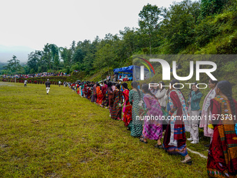 The Nepalese community wears traditional clothes and celebrates the Dhan Ropai festival in Panchthar, Nepal, on September 14, 2024. (