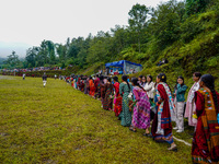 The Nepalese community wears traditional clothes and celebrates the Dhan Ropai festival in Panchthar, Nepal, on September 14, 2024. (