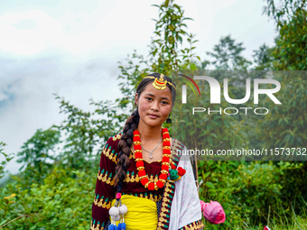 The Nepalese community wears traditional clothes and celebrates the Dhan Ropai festival in Panchthar, Nepal, on September 14, 2024. (