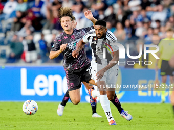 Lorenzo Colombo of Empoli FC and Bremer of Juventus FC compete for the ball during the Serie A Enilive match between Empoli FC and Juventus...